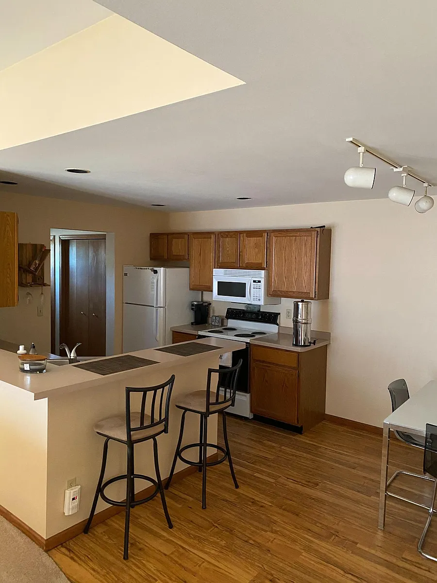 Dining area and Kitchen looking in to Laundry Room. - 109 Joyce Dr #1