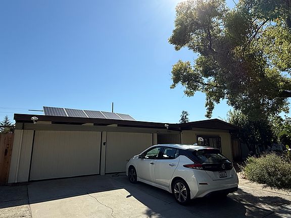 Off street parking spot for one vehicle included, electric car charger available at cost