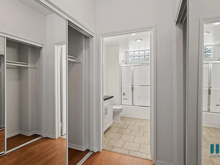 Bedroom with Full-Size Bathroom and Multiple Closets
