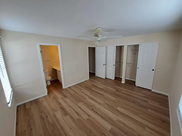 Master bath with shower, double closets with shelves.