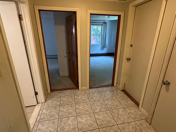 Hall to bathroom, bedroom #1, bedroom #2, and basement for laundry.