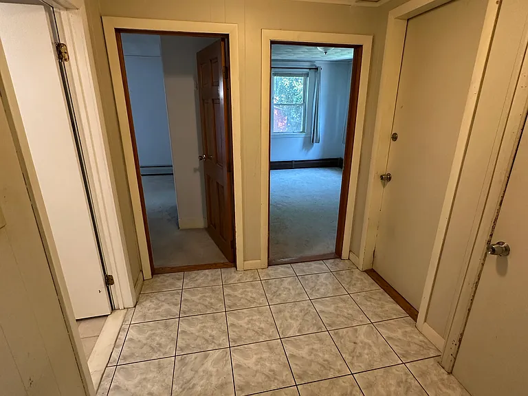 Hall to bathroom, bedroom #1, bedroom #2, and basement for laundry.