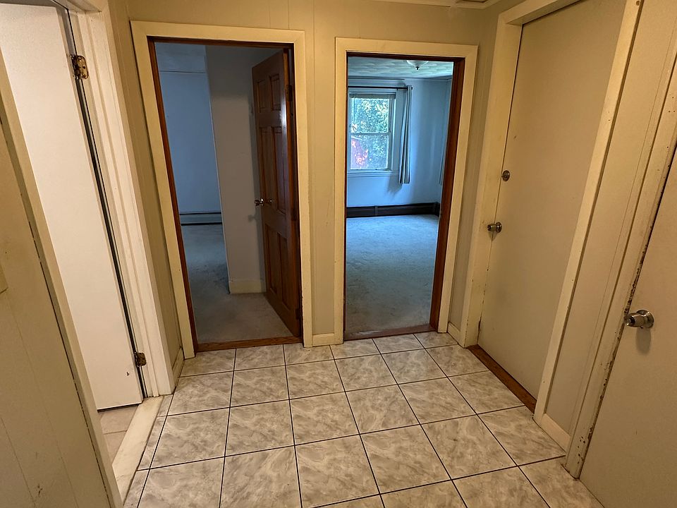 Hall to bathroom, bedroom #1, bedroom #2, and basement for laundry.