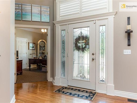 Stunning leaded glass door and side panels.  Plantation shutters throughout the main floor.