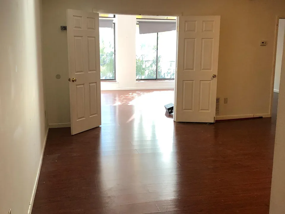 Part of the living room watching over the first bedroom.