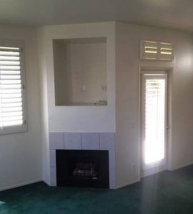 Living room w/ fireplace.