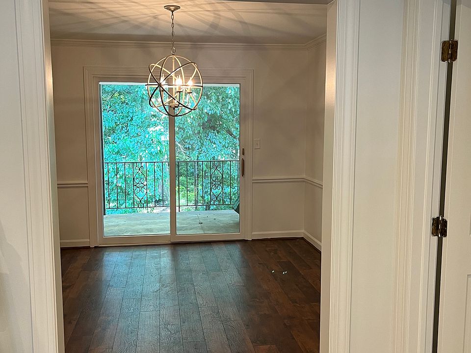 View from Living room into charming dining area. Sliding glass door leads to a small upstairs balcony. Great coffee spot.