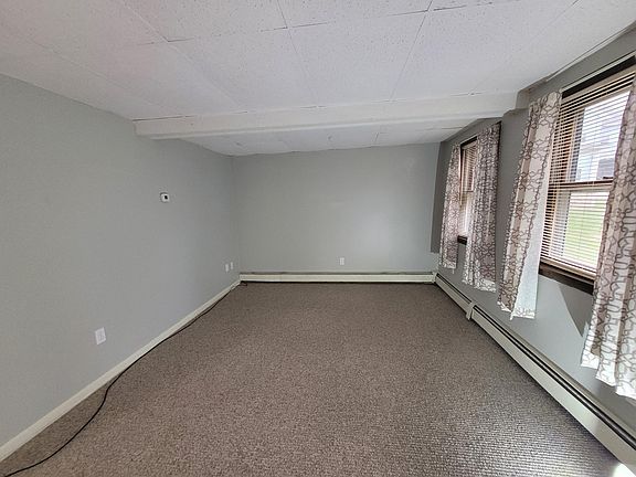 Bright living room with new carpet!