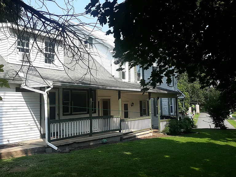 The side of home is attached to a separate rear apartment which has already been rented.