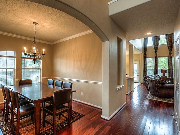 Formal dining room is one of the rooms with beautiful Brazilian Cherry wood floors.