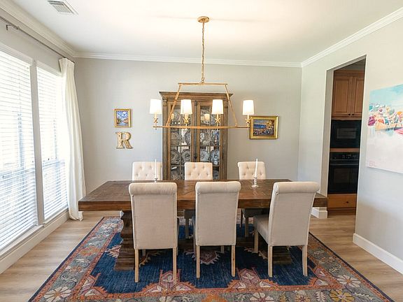 Formal dining room with designer chandelier