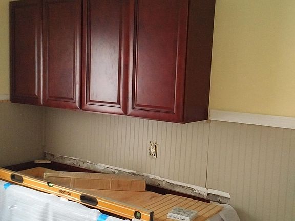 kitchen going through rehab - new floor, cabinets, granite c