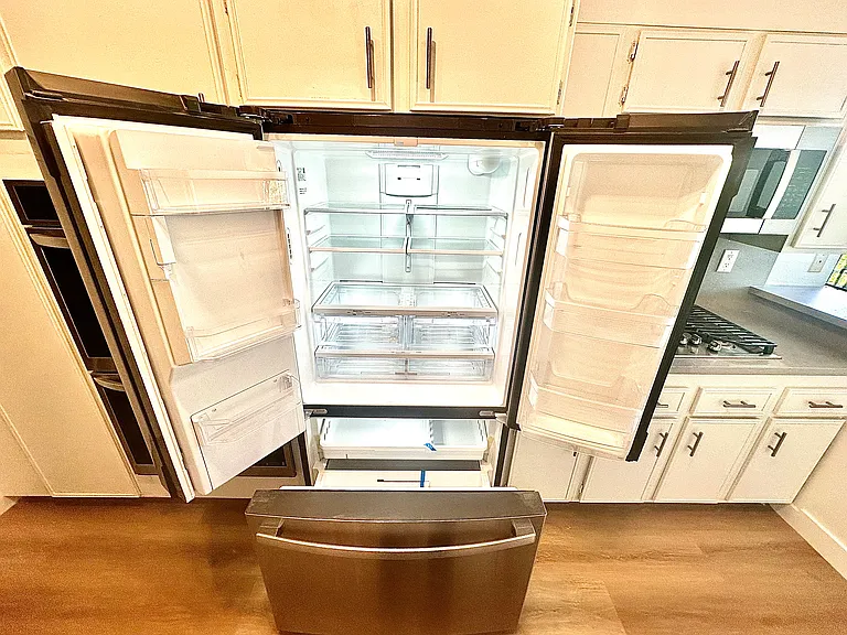 Unit #302 top of the line refrigerator with water dispenser and ice maker!