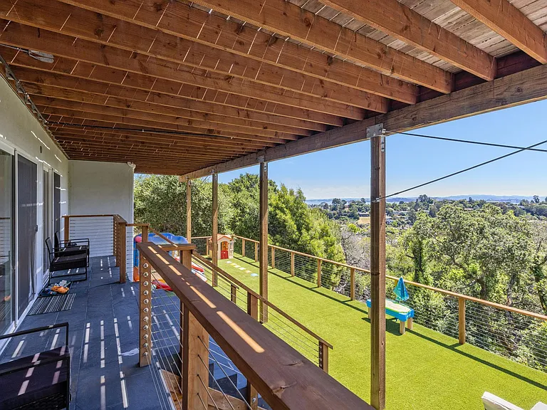 Landing and deck on lower level, accessed from lower level living / play space
