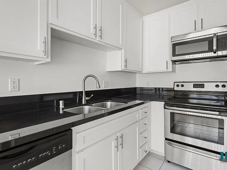 Kitchen with Dishwasher, Stove, Microwave Oven, and Refrigerator