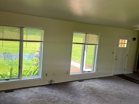 Living room showing yard and parking