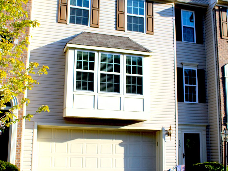 Front of Home w/ 2 Car Garage & Bump Out
