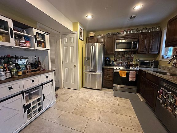 Granite countertop with gleaming appliances