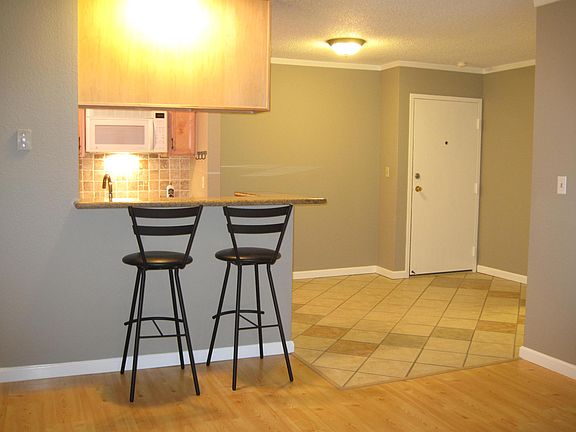 view from fireplace to the dining area and front door