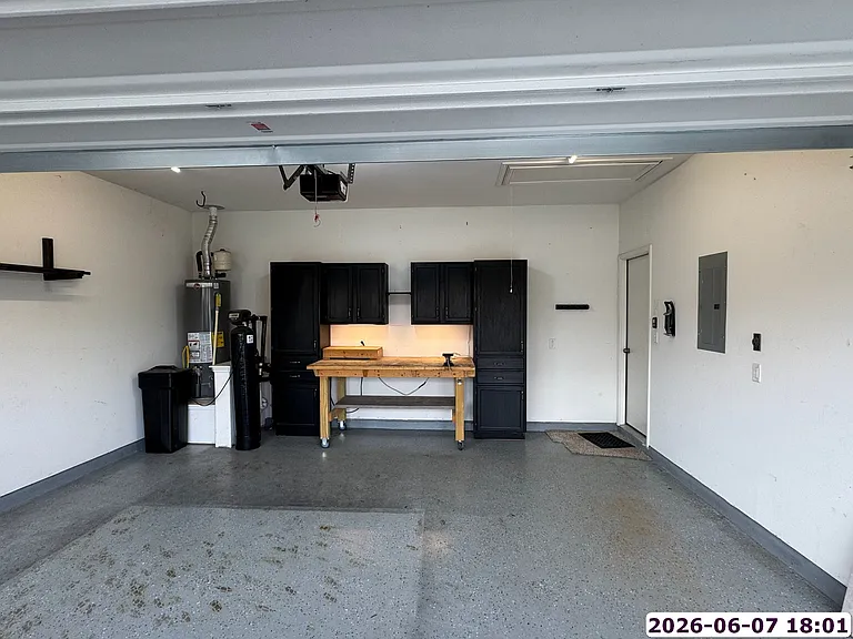 Garage (push mower, work bench, and cabinets stay with unit)