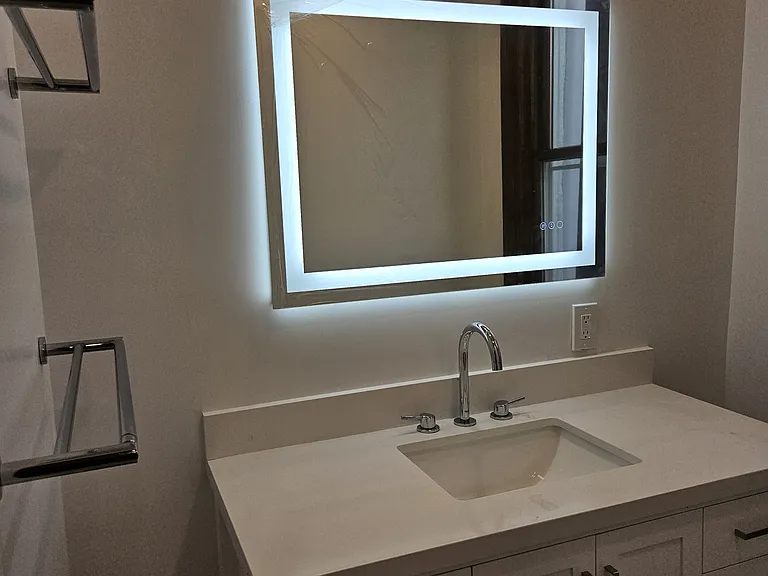 3d floor: bathroom vanity, lighted mirror and towel bars