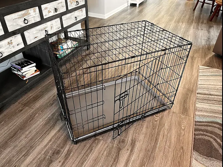 There is a large dog crate available for your use during your stay. Please ensure to wipe it down, collapse it, and return it under the bed.