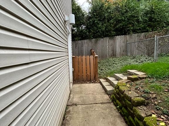 Walkway between units,gate to private backyard.