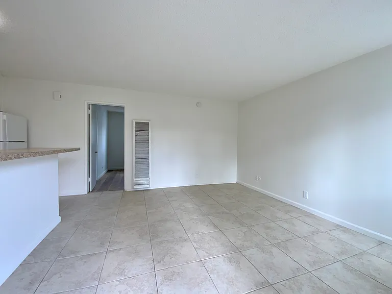 Living Area; Photos of a similar unit. Available unit has luxury vinyl "wood" plank flooring throughout except in the bedroom (high grade Berber carpet).