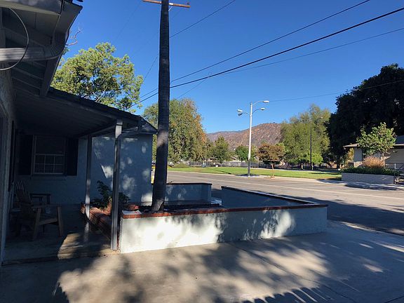 Relax on you covered front porch. View from front driveway looking across the street at Finkbiner park.