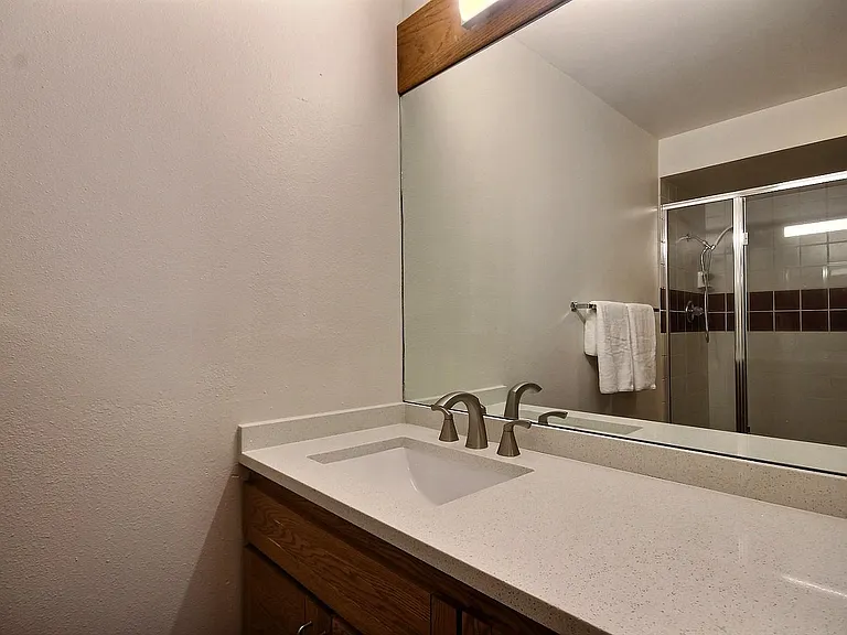 A shower room with double shower heads for two people