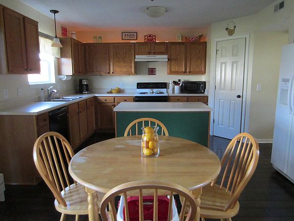 Open concept Kitchen with plenty of cabinets.