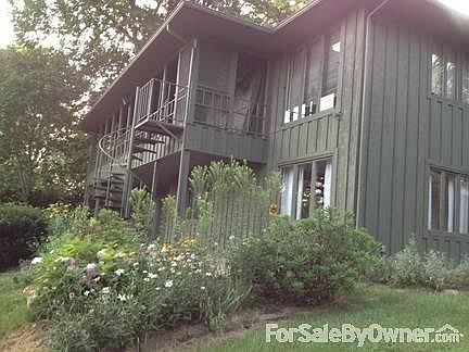 Exterior view of house from backyard.
						:
						Notice the spectacular landscaping!