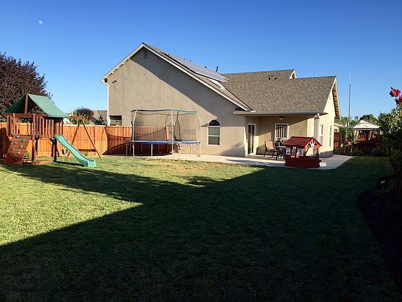 Backyard - wooden swingset to stay with house