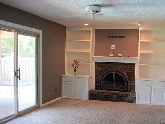 Custom built cabinets surround the fireplace