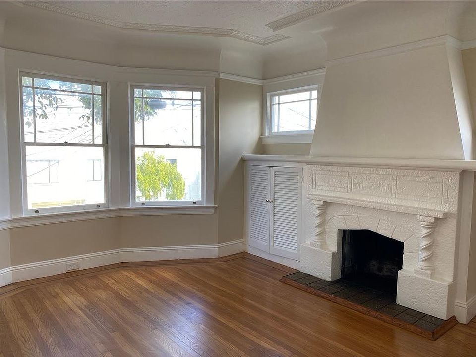 Large living room with beautiful fireplace. West and north facing windows.