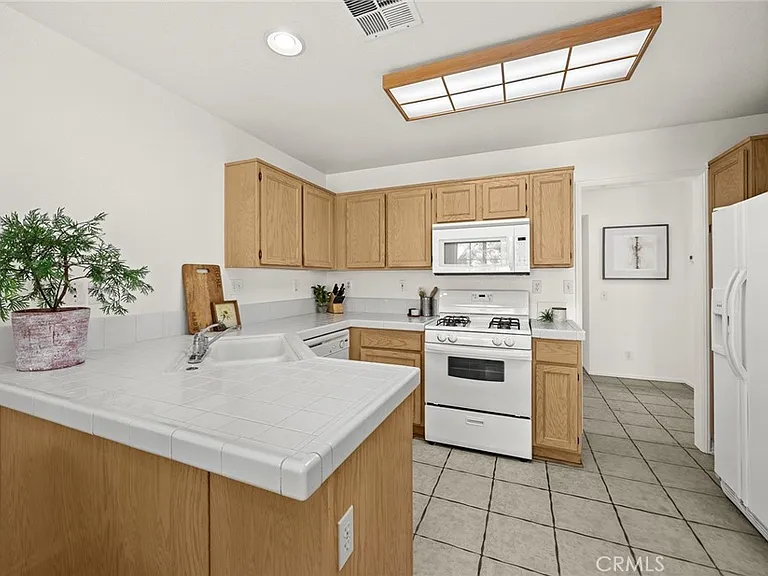 Bright kitchen with an optional refrigerator.
