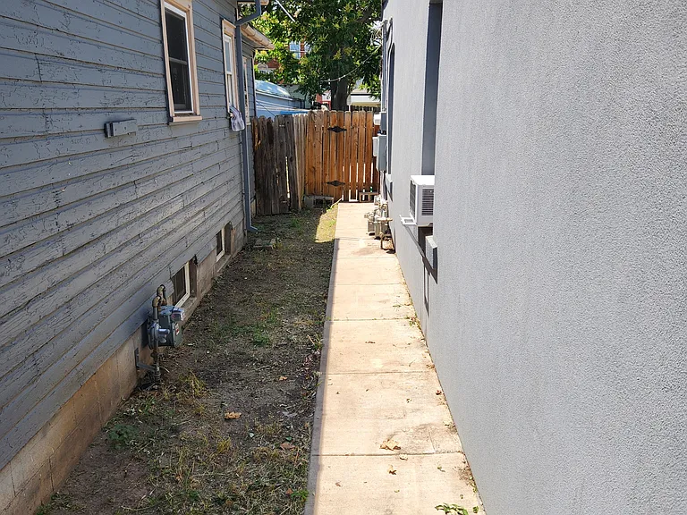 Side Yard. Ample space for outdoor storage items (kayak, paddle board, etc.)