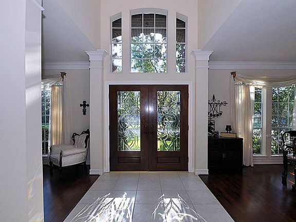 Entry leads into formal living and dining rooms