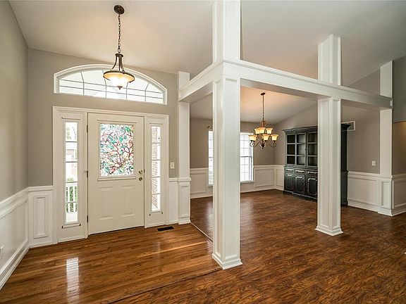 The entry is open and bright with the half glass front door, sidelights and arched transom window.  The formal Dining room is spacious and open.