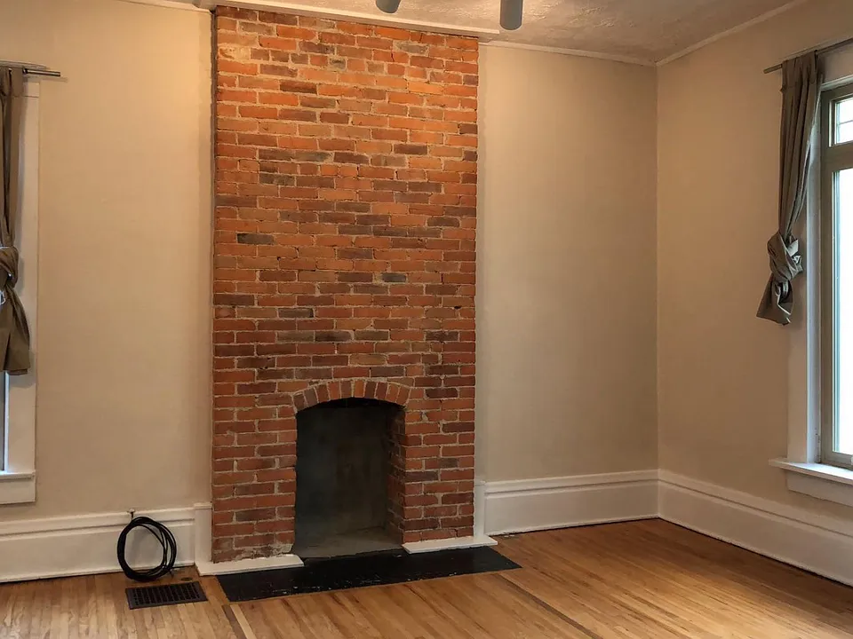 One view of very large living room, through french doors connected to the entry hall.