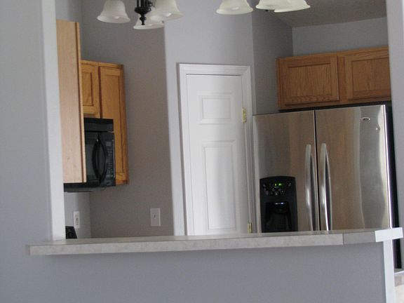 Standing in the living room as you open the front door.