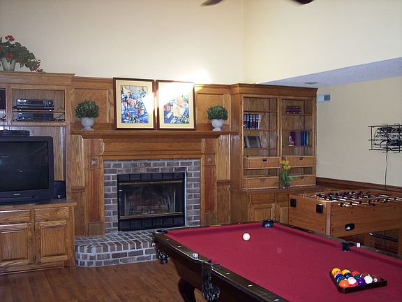 Family room with fireplace and custom oak paneling