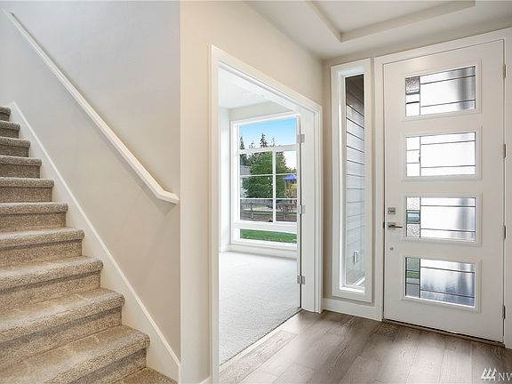 Plan 3014 entry. Photos of 3014 plan on another lot. Color details will vary.