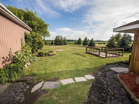 Large floating deck in the back to enjoy peaceful evenings make a great additional outdoor dining area or quiet place to enjoy the beautiful scenery...including a small pond with fountain, immersible pump and stone birdbath which stays with the home!