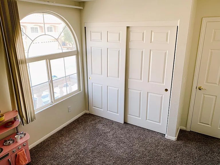 bedroom window and closet
*now features faux wood blinds
