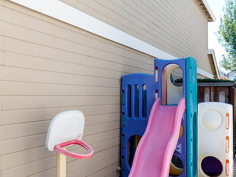 Side yard with slide for kids