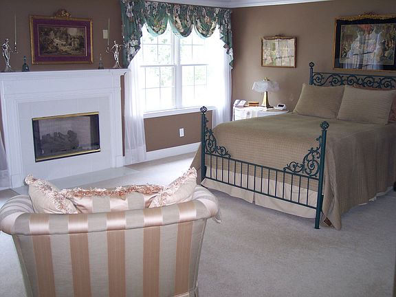 Escape to the romantic master suite with its own fireplace.