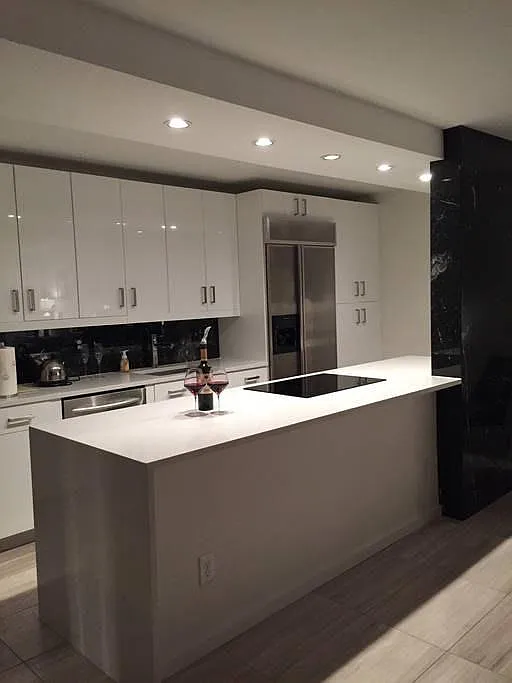 Hi-end kitchen with induction stove and marble accents - 3100 E Cherry Creek South Dr #703