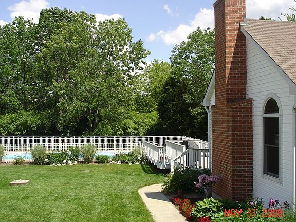 back walk, gardens, & pool