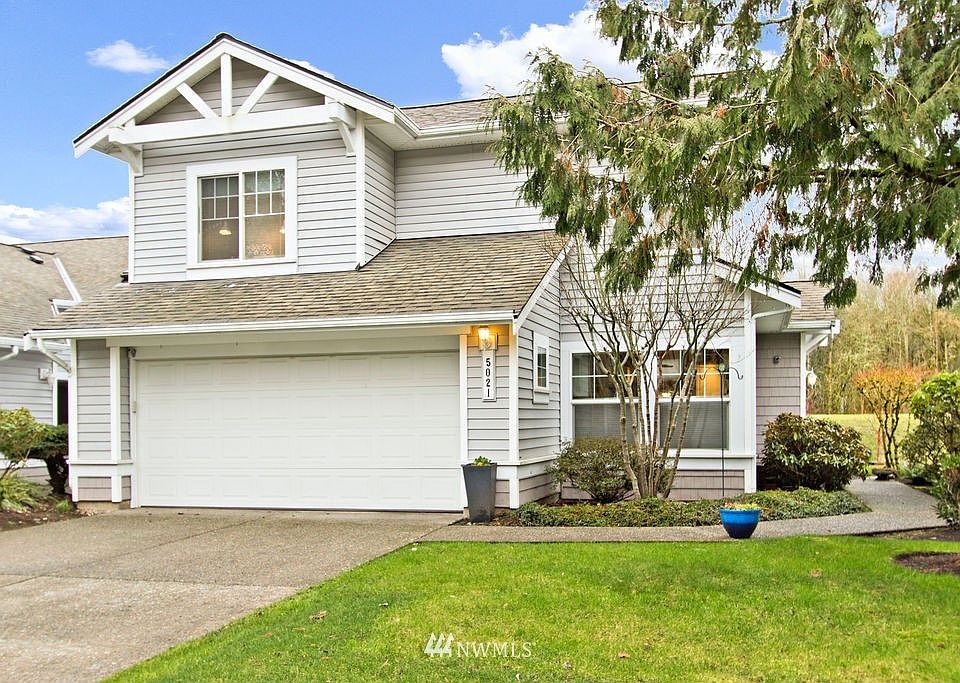 Front view with tons of parking to include oversized garage.